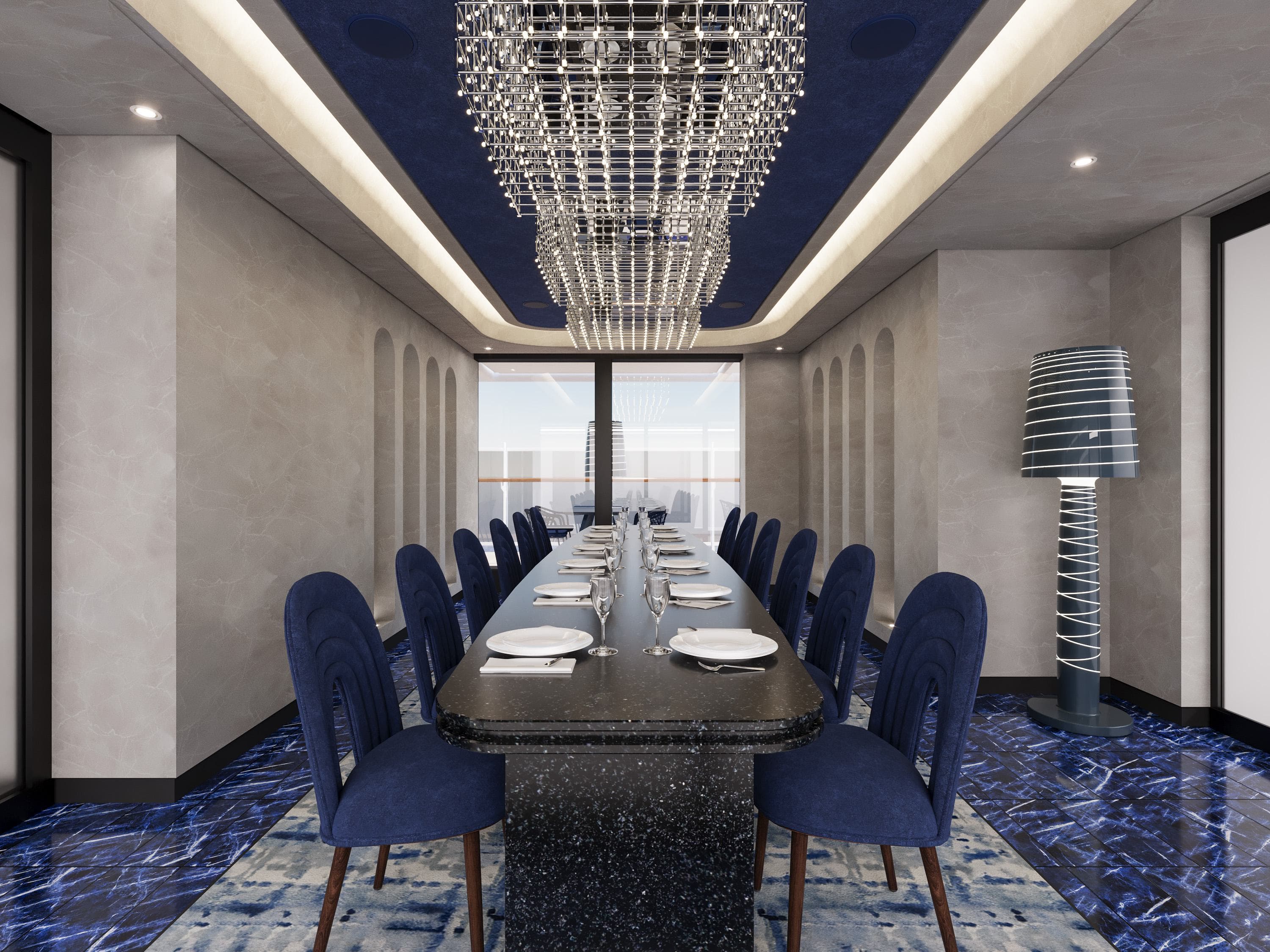The Chef's Table private dining room aboard Explora Journeys, featuring a long marble table set for a formal dinner under a crystal chandelier with deep blue accents